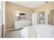 Relaxing bedroom featuring a queen-sized bed, a dresser, and a mirror at 439 Shoreview Sands Ave, Mascotte, FL 34753