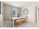 Inviting dining room with a modern table, decorative accents, comfortable seating, and natural light at 439 Shoreview Sands Ave, Mascotte, FL 34753
