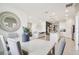 Open floorplan view of a dining room, living room, and kitchen in a well-lit and stylishly decorated space at 439 Shoreview Sands Ave, Mascotte, FL 34753