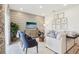 Stylish living room with a cozy seating area, modern decor, and large windows providing ample light at 439 Shoreview Sands Ave, Mascotte, FL 34753