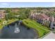 Lovely community with sidewalks, trees, and a lake with fountain at 4400 Thornbriar Ln # 104, Orlando, FL 32822