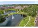Aerial view of stunning community with a pond, fountain, and mature landscaping at 4400 Thornbriar Ln # 104, Orlando, FL 32822
