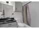 The full bathroom features a shower-tub combo, gray vanity with black countertop and single basin sink at 4400 Thornbriar Ln # 104, Orlando, FL 32822