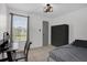 Bedroom featuring tile floors, closet and large window that lets in natural light at 4400 Thornbriar Ln # 104, Orlando, FL 32822