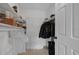 This walk-in closet has custom shelving and storage space for organization at 4400 Thornbriar Ln # 104, Orlando, FL 32822