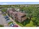 Beautiful building with brick and siding, mature trees, and ample parking at 4400 Thornbriar Ln # 104, Orlando, FL 32822