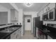 Functional kitchen layout with ample cabinet space and stainless steel appliances at 4400 Thornbriar Ln # 104, Orlando, FL 32822