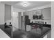 Efficient kitchen with stainless steel refrigerator and modern appliances at 4400 Thornbriar Ln # 104, Orlando, FL 32822