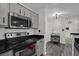 Eat-in kitchen featuring modern appliances and convenient layout at 4400 Thornbriar Ln # 104, Orlando, FL 32822