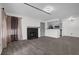 Inviting living room with a cozy fireplace, modern flooring, and neutral paint at 4400 Thornbriar Ln # 104, Orlando, FL 32822