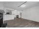 Spacious living room, view of open kitchen with stainless appliances and breakfast bar at 4400 Thornbriar Ln # 104, Orlando, FL 32822