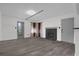 Open living space with fireplace, access to outdoor area and neutral color palette at 4400 Thornbriar Ln # 104, Orlando, FL 32822