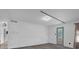 Bright living room showcasing natural light and access to outdoor area at 4400 Thornbriar Ln # 104, Orlando, FL 32822