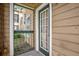 The porch features an exterior door and a secure entry for peace of mind at 4400 Thornbriar Ln # 104, Orlando, FL 32822