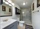 Updated bathroom with stylish vanity and walk-in shower at 4519 Se 140Th Pl, Summerfield, FL 34491