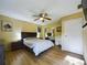 Spacious bedroom with ample closet space and laminate flooring at 4519 Se 140Th Pl, Summerfield, FL 34491