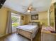Comfortable bedroom featuring natural light and ample space at 4519 Se 140Th Pl, Summerfield, FL 34491
