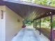 Convenient carport providing covered parking and storage at 4519 Se 140Th Pl, Summerfield, FL 34491