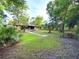Sprawling front yard with mature trees and a charming single-story home in a park-like setting at 4519 Se 140Th Pl, Summerfield, FL 34491