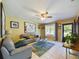 Inviting living room with neutral tones, stylish furnishings, and natural light at 4519 Se 140Th Pl, Summerfield, FL 34491