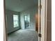 Cozy bedroom features soft carpeting and windows, creating a comfortable living space at 4586 Se 25Th Loop, Ocala, FL 34480