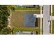 Bird's eye view of property showing roof, driveway, and surrounding landscaping at 4905 Pall Mall E St, Kissimmee, FL 34758