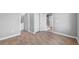 Bedroom with neutral walls, vinyl floors, closet, and an ensuite bathroom at 4905 Pall Mall E St, Kissimmee, FL 34758