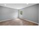 Clean bedroom features laminate floors and a large window offering plenty of natural light at 4905 Pall Mall E St, Kissimmee, FL 34758