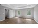 Bright room showcasing wood floors, a tray ceiling, and large windows at 4905 Pall Mall E St, Kissimmee, FL 34758