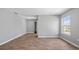 Spacious room featuring wood floors and a window offering ample natural light at 4905 Pall Mall E St, Kissimmee, FL 34758
