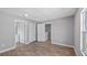 Neutral bedroom features laminate floors and access to a bathroom, closets and other rooms at 4905 Pall Mall E St, Kissimmee, FL 34758