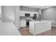 Bright kitchen featuring a central island, sleek appliances, and plenty of cabinet space for storage at 4905 Pall Mall E St, Kissimmee, FL 34758