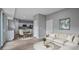 Open living room with neutral decor, dining area, and views to modern kitchen at 4905 Pall Mall E St, Kissimmee, FL 34758