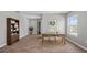Bright home office features wood desk, laminate floors, and a large window with natural light at 4905 Pall Mall E St, Kissimmee, FL 34758