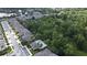 Aerial view of homes in a community with a pool surrounded by lush landscaping at 506 Harbor Winds Ct, Winter Springs, FL 32708