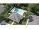 Aerial view of the community pool surrounded by lush landscaping and palm trees at 506 Harbor Winds Ct, Winter Springs, FL 32708