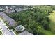 Aerial view of homes in a community with a pool surrounded by lush landscaping at 506 Harbor Winds Ct, Winter Springs, FL 32708