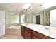 The well-lit bathroom features an oversized mirror, dual sinks, a soaking tub, and a separate shower at 506 Harbor Winds Ct, Winter Springs, FL 32708
