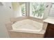 Bathroom features a large soaking tub, perfect for relaxation after a long day at 506 Harbor Winds Ct, Winter Springs, FL 32708