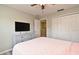Cozy bedroom with a dresser, TV, ceiling fan and closet, all conveniently located near the doorway at 506 Harbor Winds Ct, Winter Springs, FL 32708