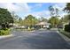 Community entrance with a gate at 506 Harbor Winds Ct, Winter Springs, FL 32708