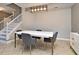 Dining area featuring modern light fixture, table and view of stairs at 506 Harbor Winds Ct, Winter Springs, FL 32708