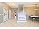 Entryway with decorative glass door and staircase leading to upper level at 506 Harbor Winds Ct, Winter Springs, FL 32708