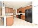 Modern kitchen featuring wood cabinets, an island, and updated appliances at 506 Harbor Winds Ct, Winter Springs, FL 32708