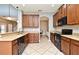 Updated kitchen with granite countertops, stainless steel appliances, and ample cabinet space at 506 Harbor Winds Ct, Winter Springs, FL 32708