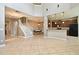 Spacious open-concept living area with tile floors connecting the kitchen and dining room at 506 Harbor Winds Ct, Winter Springs, FL 32708