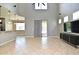 Spacious living room with high ceilings and tile flooring, adjacent to kitchen at 506 Harbor Winds Ct, Winter Springs, FL 32708