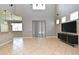 Open living area with tile flooring, high ceilings, lots of light, modern furnishings and a view to the kitchen at 506 Harbor Winds Ct, Winter Springs, FL 32708