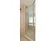 Walk-in shower enclosed with glass and beige tile at 506 Harbor Winds Ct, Winter Springs, FL 32708