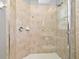 This tile shower features a frameless glass enclosure, rainfall shower head, and shower caddy at 506 Harbor Winds Ct, Winter Springs, FL 32708